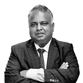 A black and white portrait of Sandeep Shilawat, Vice President of oLabs' Cloud Center of Excellence.